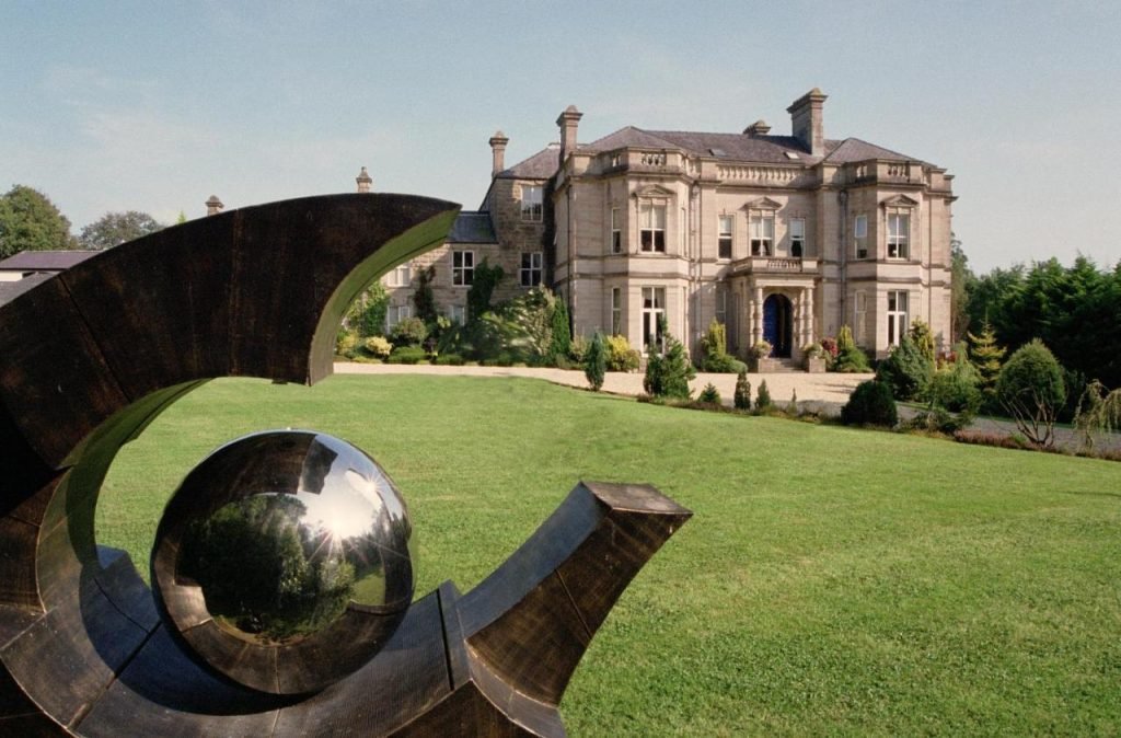 Exterior of Tre‑Ysgawen Hall Country House Hotel & Spa with landscaped grounds on the Isle of Anglesey.