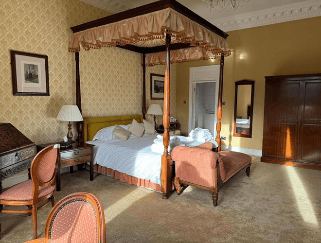 Luxury spa break accommodation in Anglesey with elegant four poster bedroom