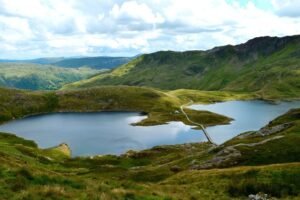 Snowdonia mountains with dramatic peaks, lakes, and scenic landscape in North Wales