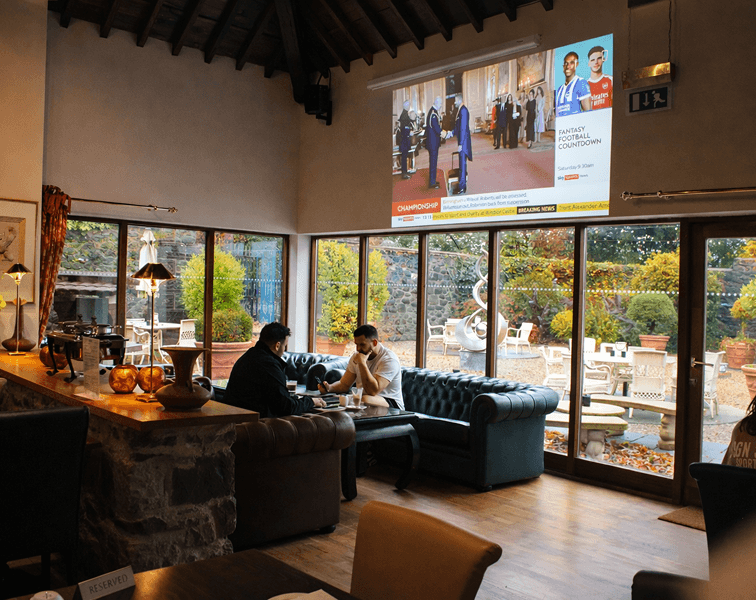 Guests relaxing in spa lounge area at Tre-Ysgawen Hall in Anglesey