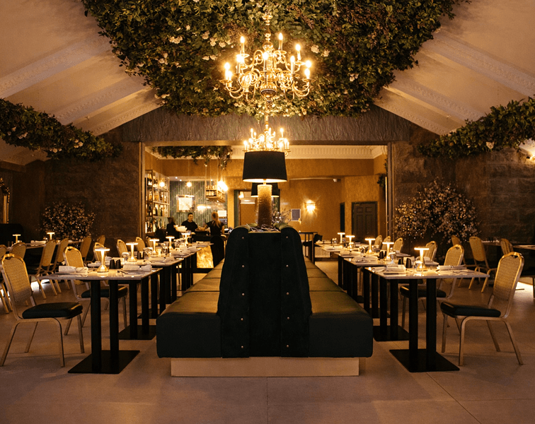 Elegant dining area at Romana's Restaurant in Tre-Ysgawen Hall Hotel & Spa, Anglesey, featuring stylish interiors and ambient lighting