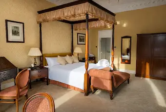 Standard four-poster hotel room at Tre-Ysgawen Hall